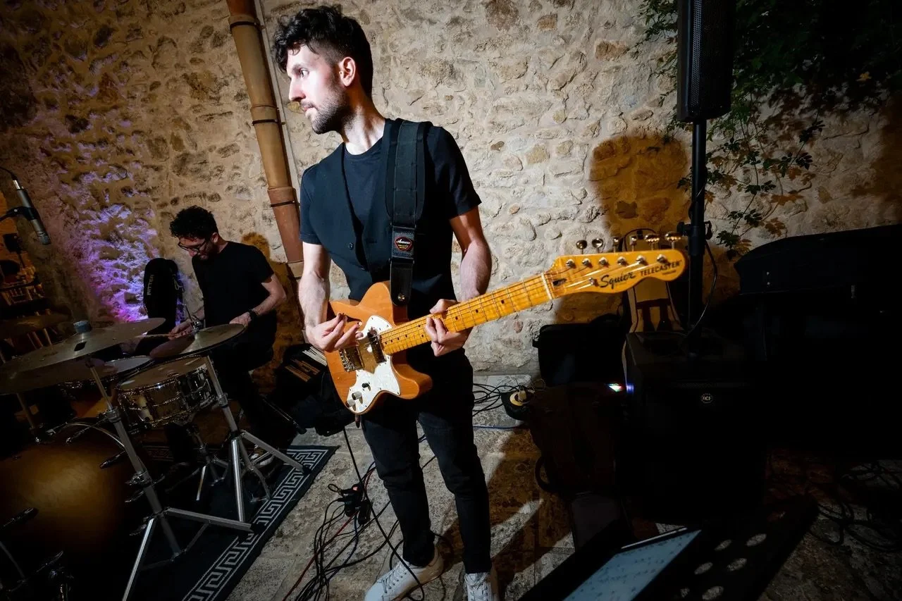 Electric guitarist performing with Riccardo's live wedding band at a destination wedding in Italy.