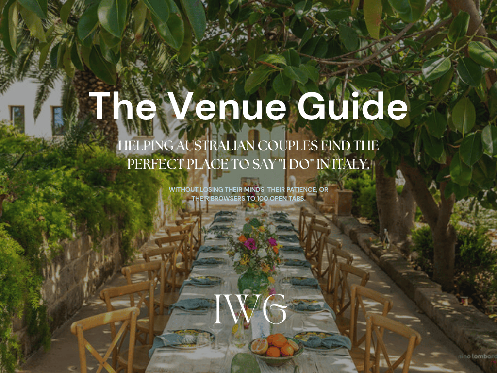 Elegant long outdoor wedding reception table in an Italian garden with greenery and wooden chairs, venue guide hero image