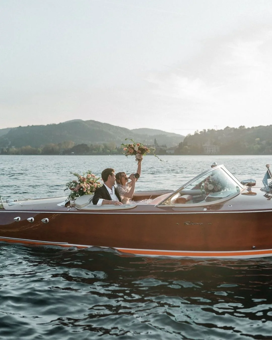 lake-wedding-champagne-boat-bride-groom.jpg
