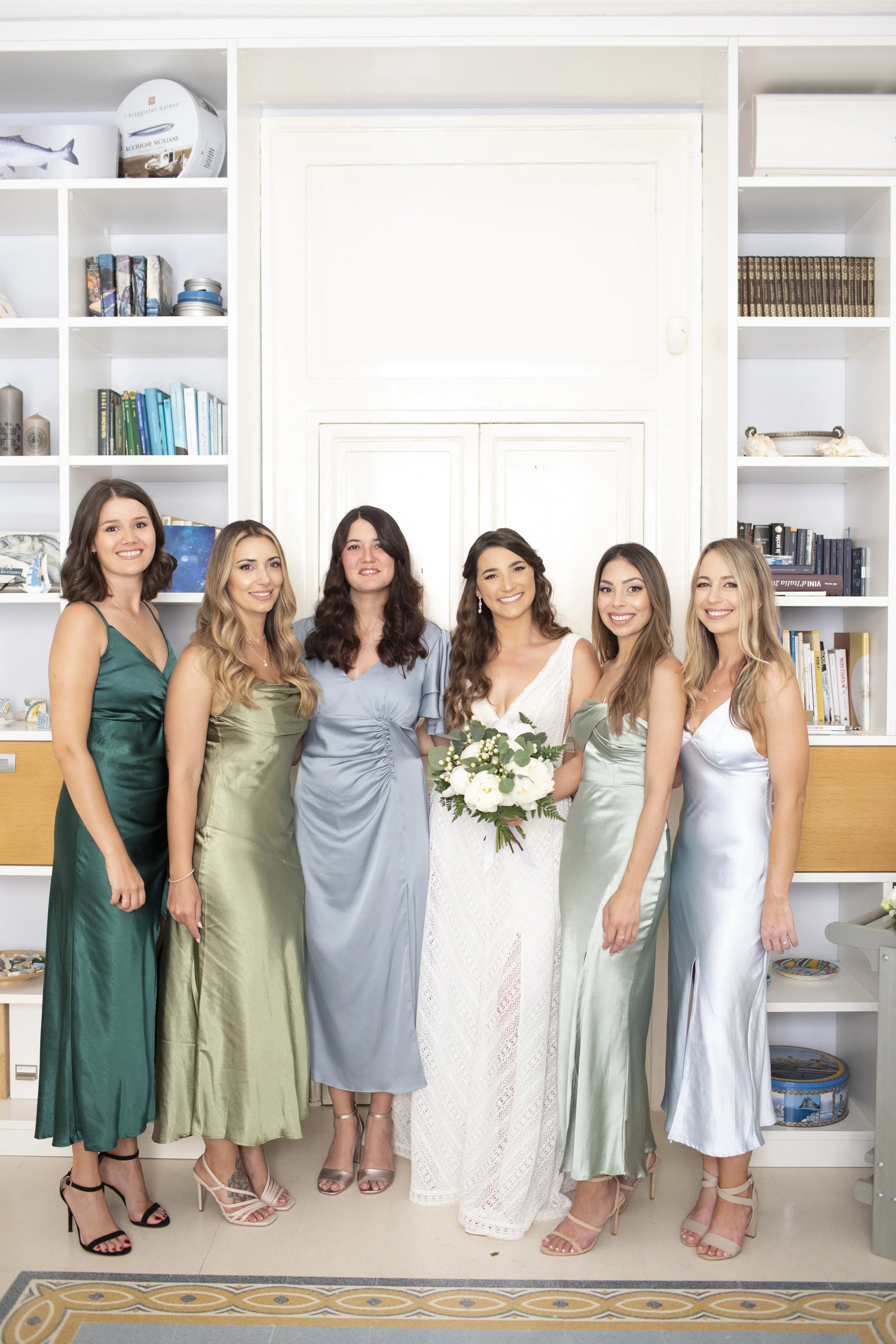 Bride with bridesmaids showcasing elegant natural bridal makeup by Sonia Cuddemi in Sicily