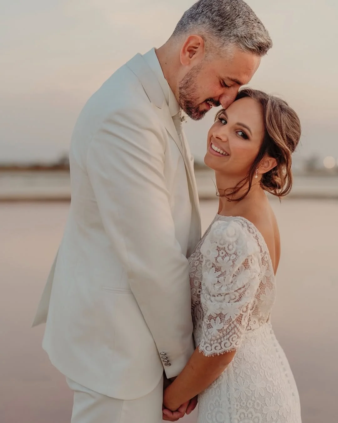 Bride showcasing elegant natural bridal makeup by Sonia Cuddemi during a romantic destination wedding in Sicily