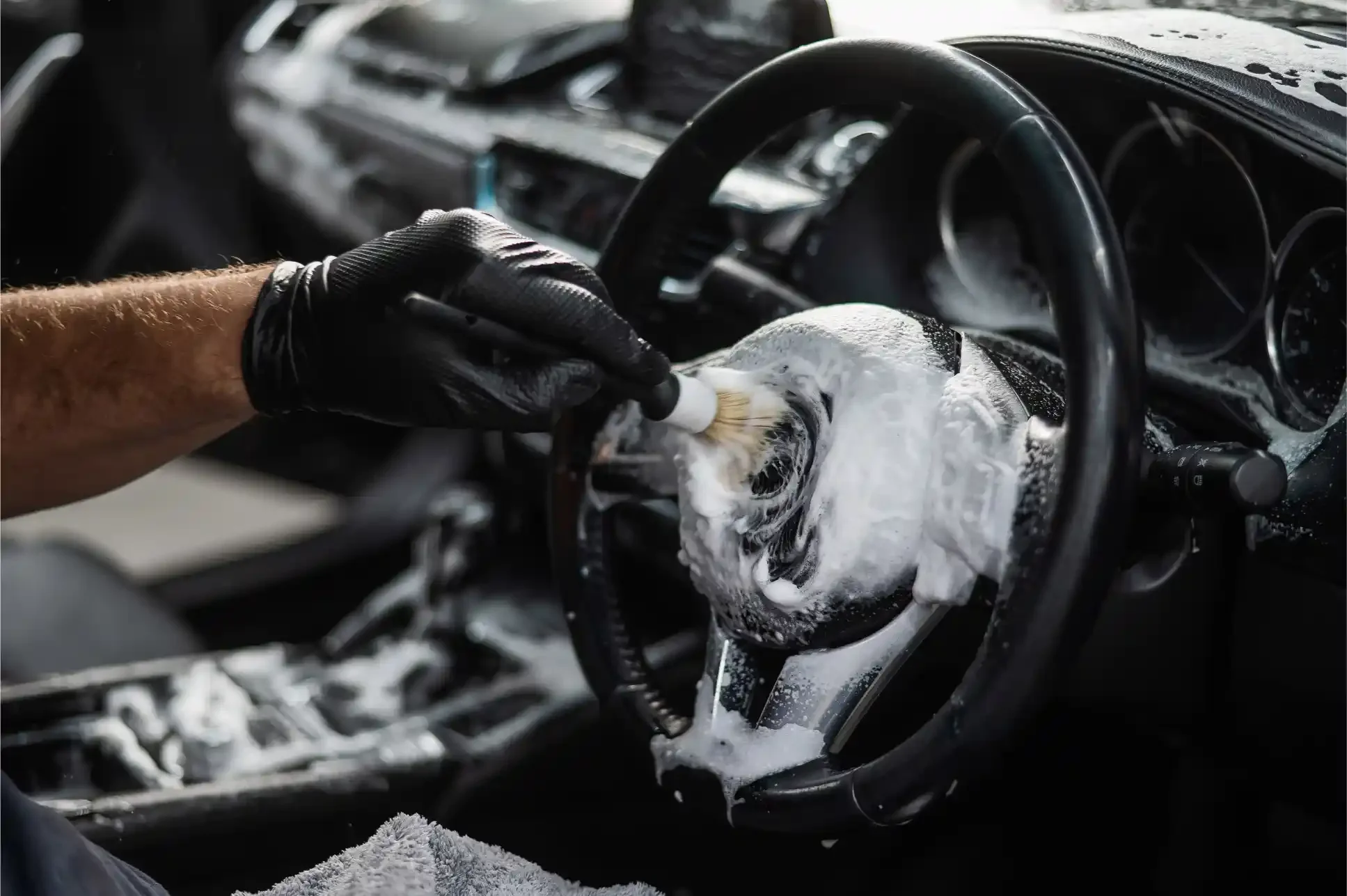 Mobile car interior detailing in Lincoln NE - thorough steering wheel cleaning with foam and microfiber