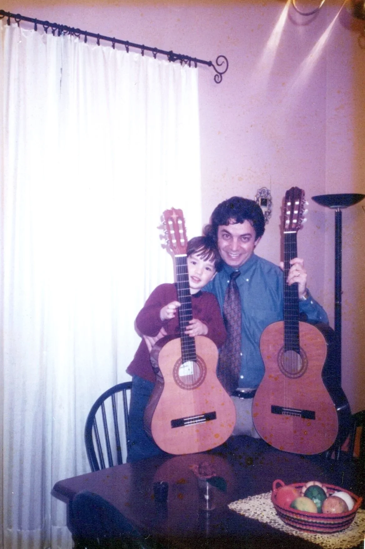 With my son with his guitar.  Now an artist and talented musician, multi instrumentalist, in his own right.