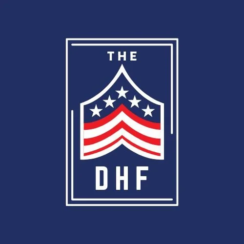 DHF logo on a blue background featuring a stylized military stripe design with red, white, and blue colors, stars, and the text 'THE DHF.'