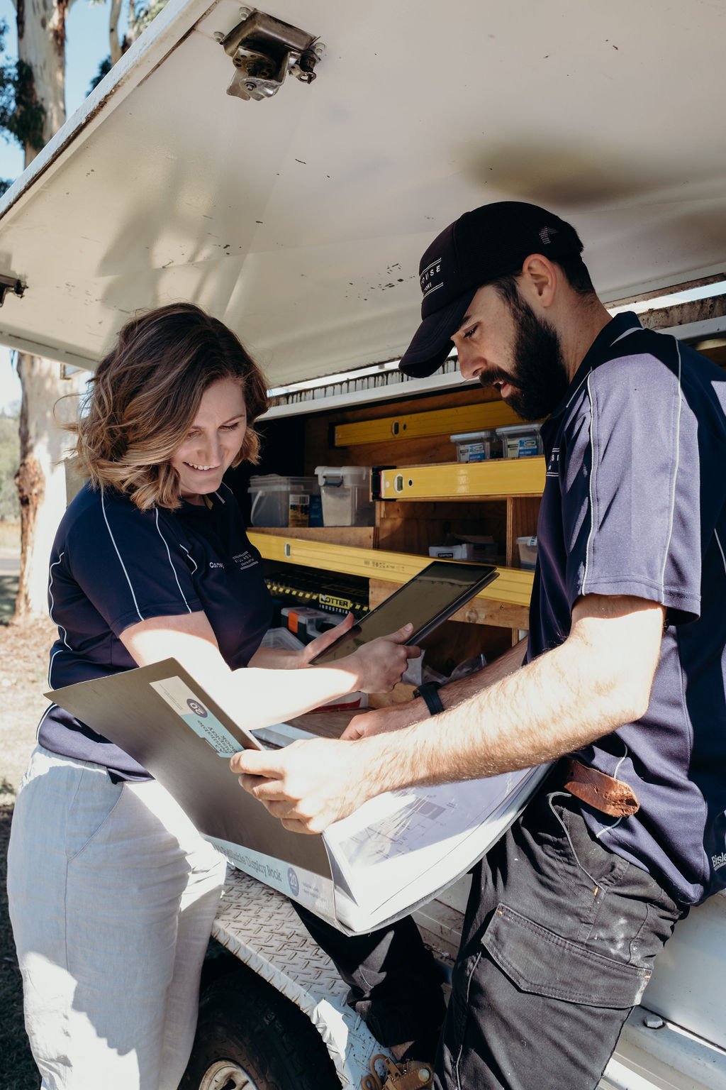James and Courtney Hill from Hill House Design & Construct reviewing renovation plans on site during the pre-construction stage.