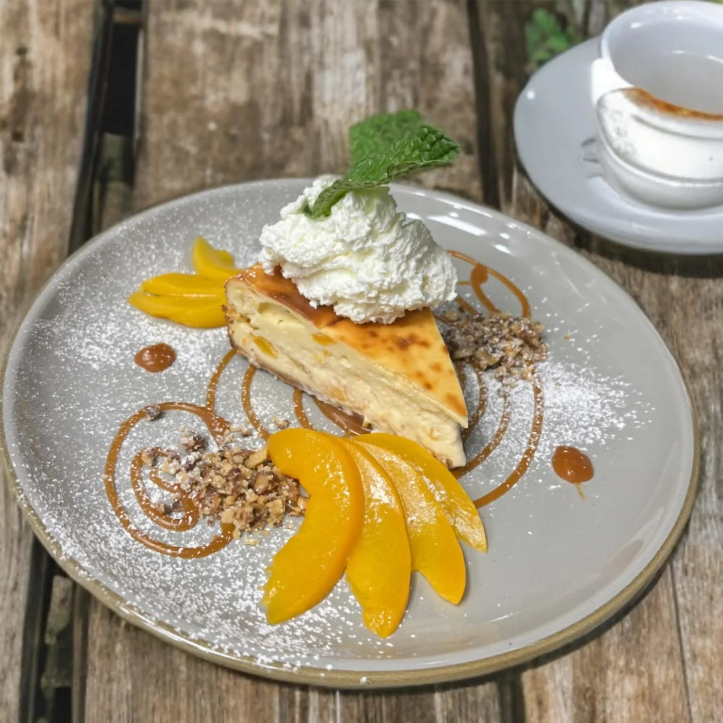 Peachy, creamy, cloud-like perfection 🍑 Our peach cheesecake is the perfect addition to a cozy weekend. #cheesecake #marineats #foodlover #desserts #onlyinfairfax #supportlocal