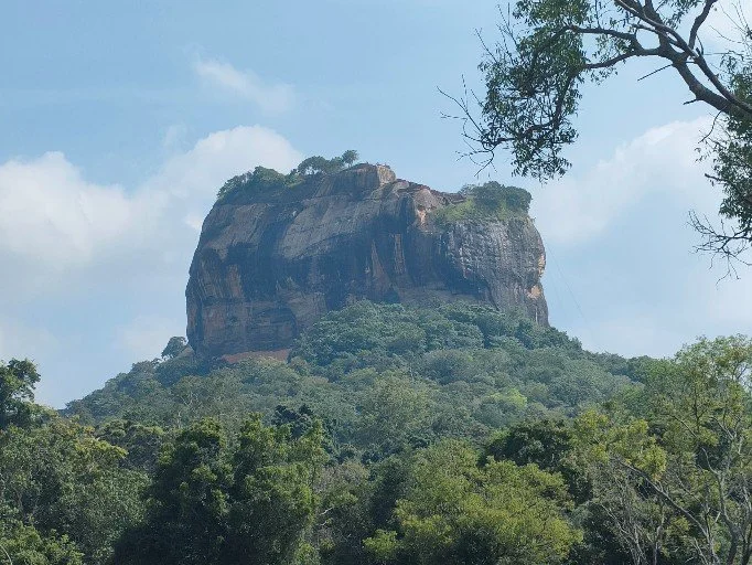 Sigiriya Rock — a solitary giant rising from the jungle, where stone meets sky and legend was  carved into the heart of Sri Lanka."