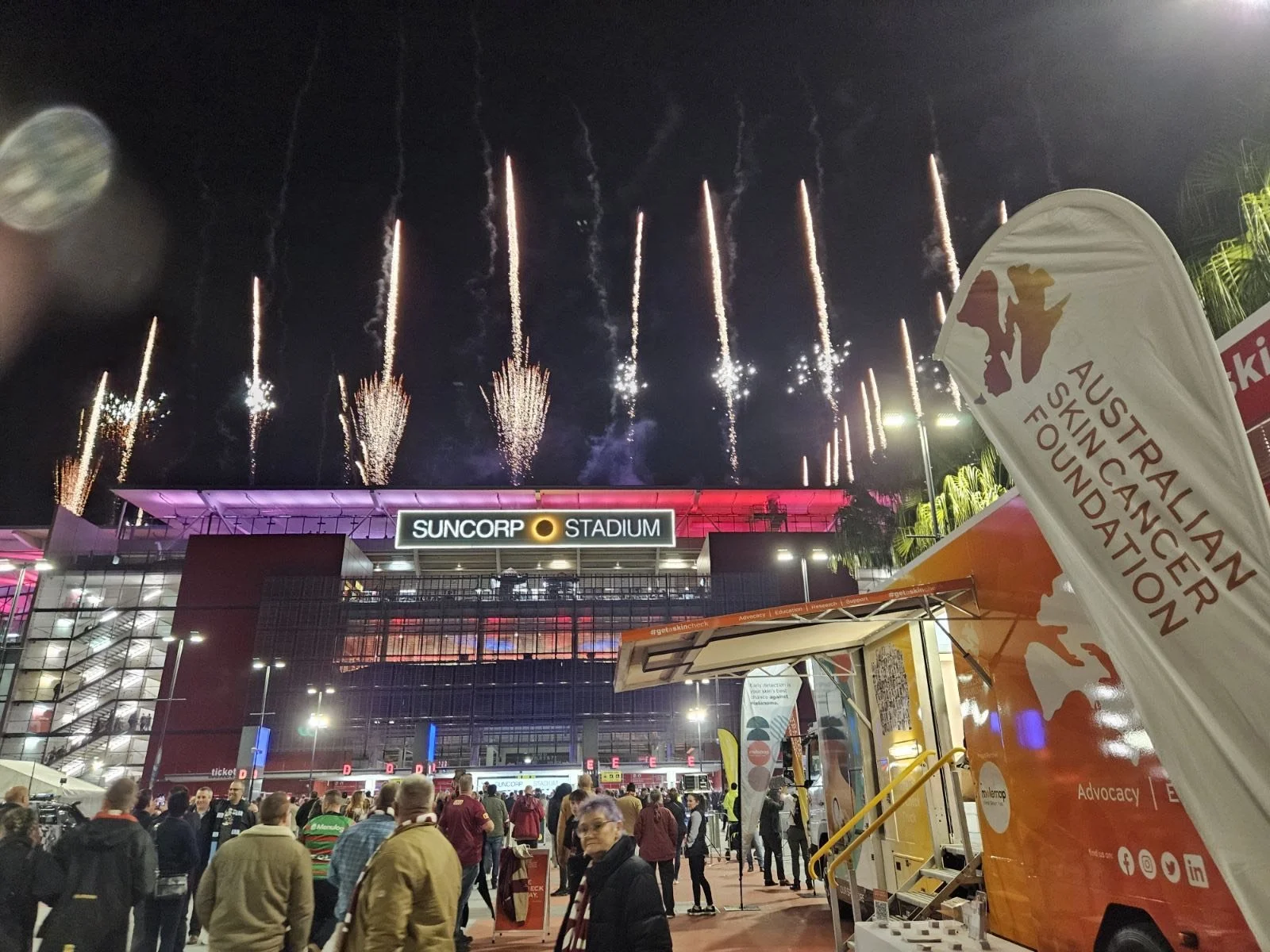 Checking people's skin at the NRL State Of Origin in Brisbane 