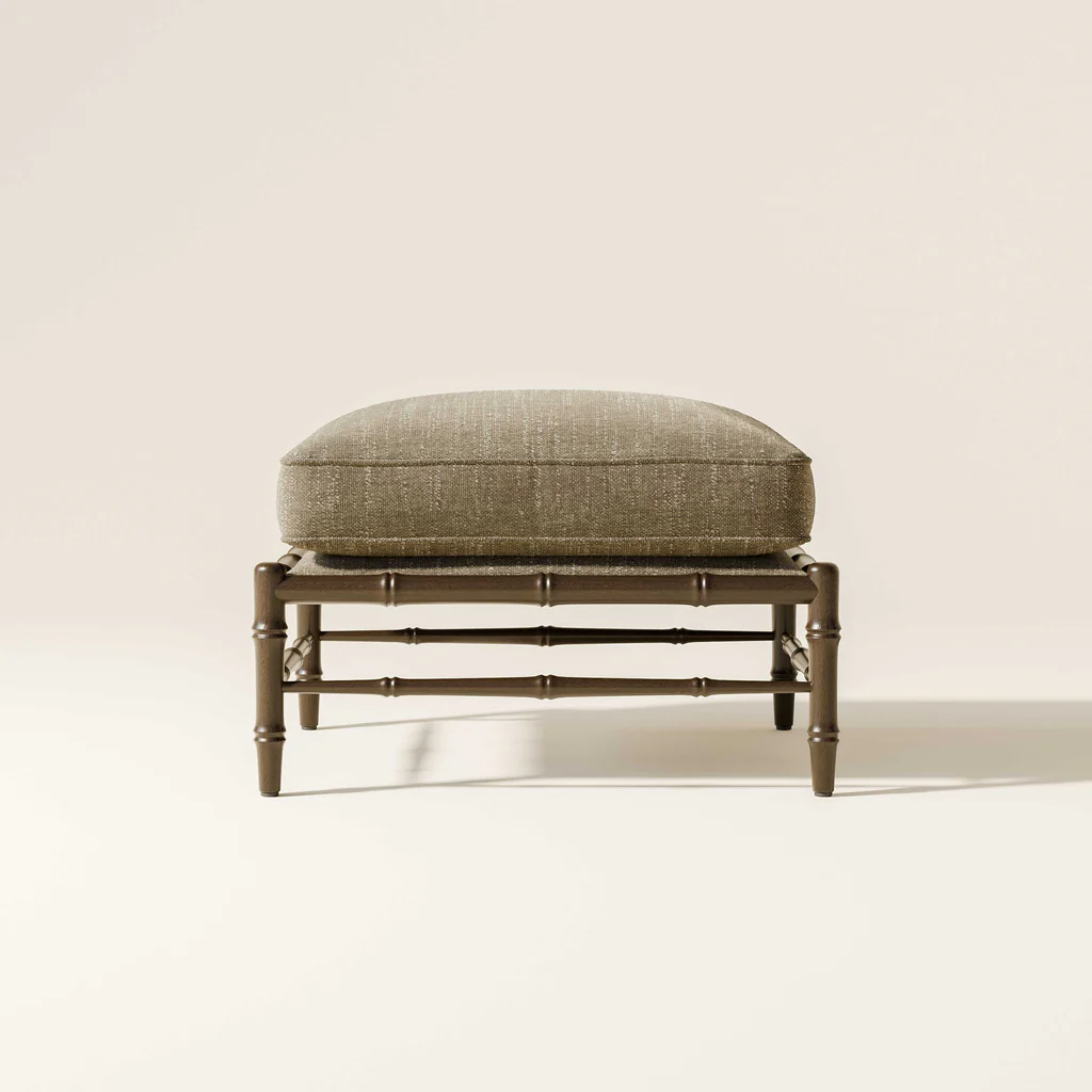 A cushioned stool with a brown fabric top placed on a wooden frame against a plain off-white background.