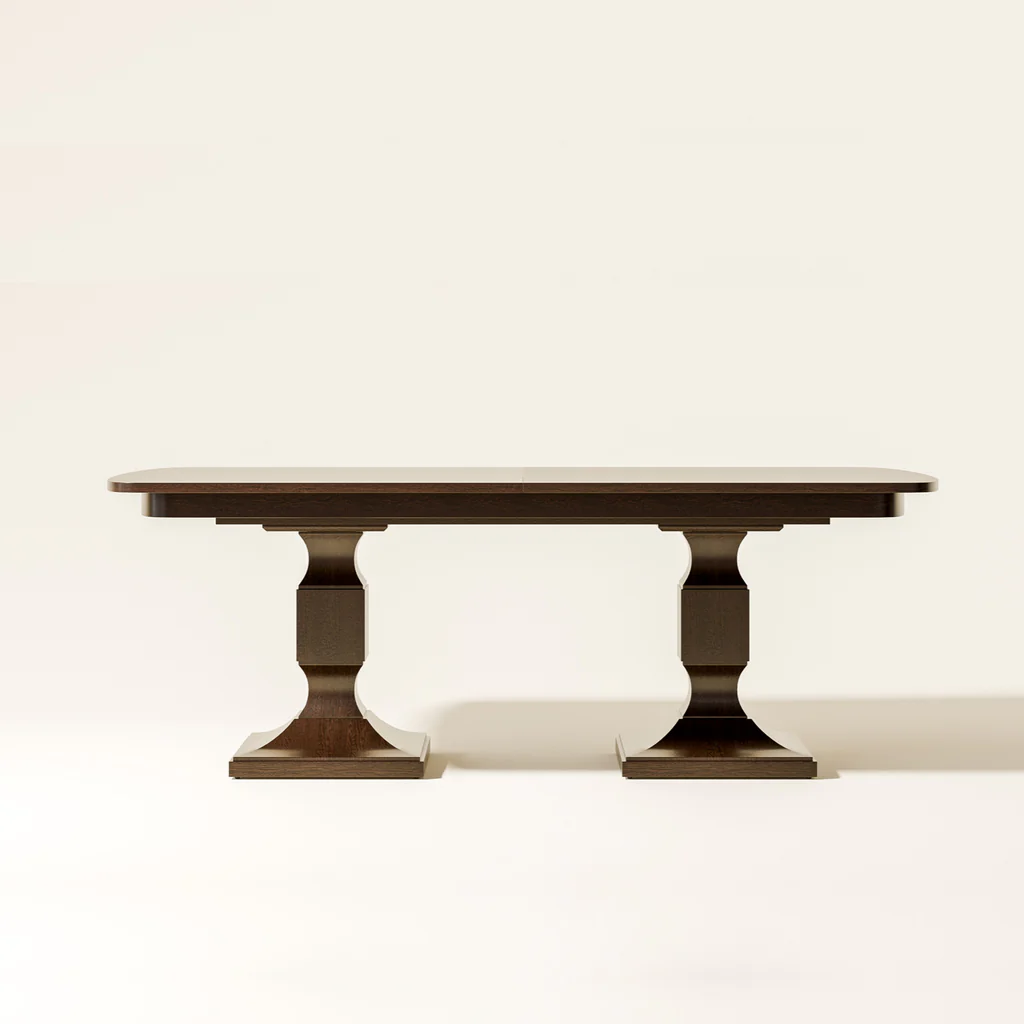 A wooden dining table with a dark finish and a dopply pedestal base, placed against a plain light background.