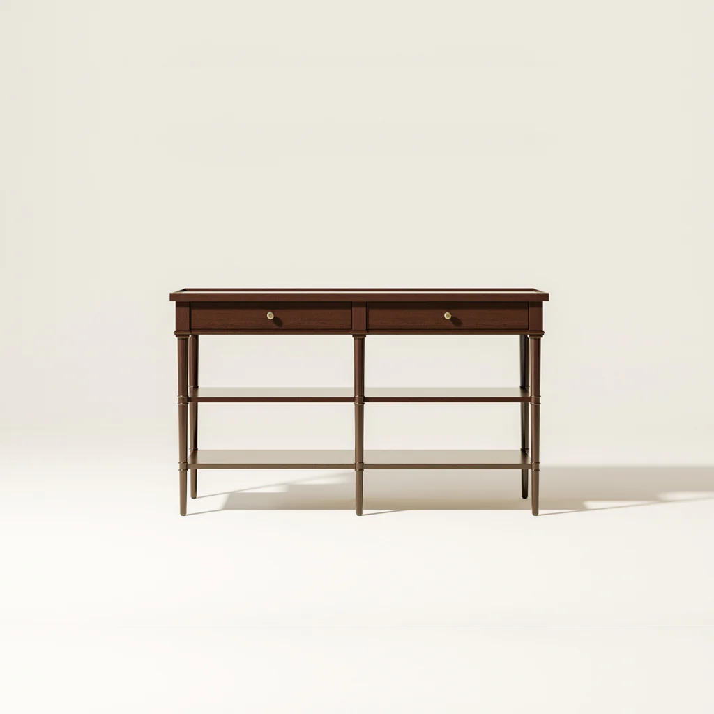 A wooden console table with two drawers and four shelves against a plain light-colored wall.