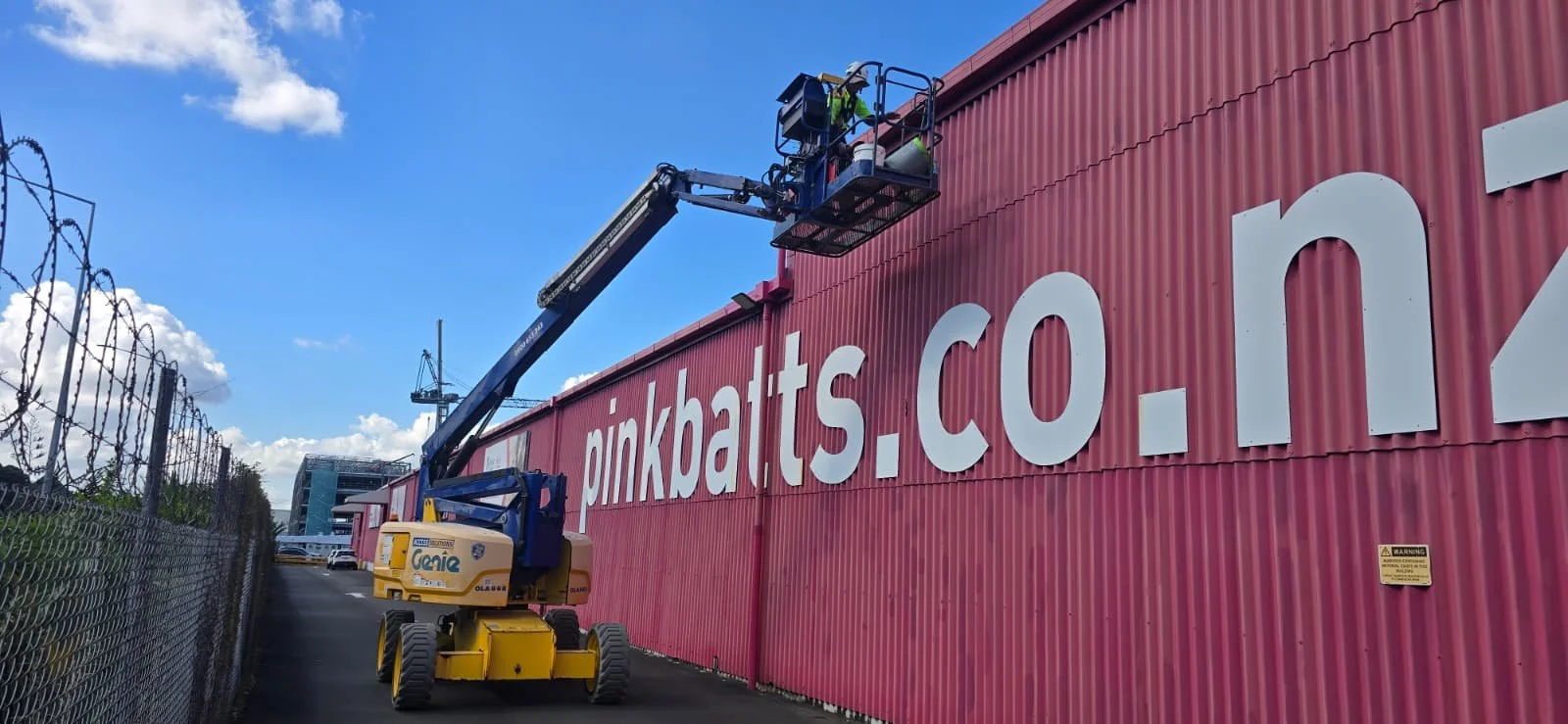 Commercial maintenance inspection using an knuckle boom for access.