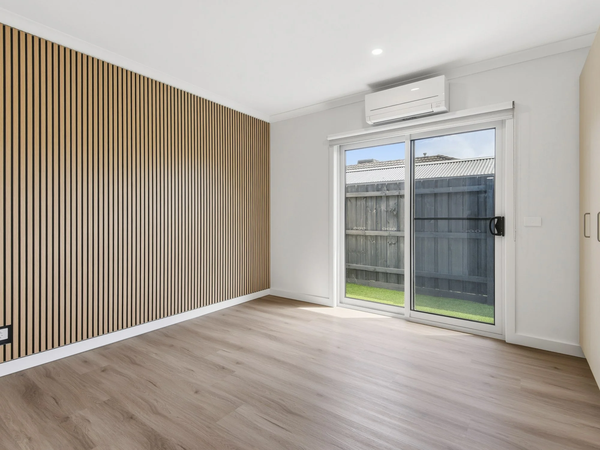 studio room in a rooming house with acoustic wall panels