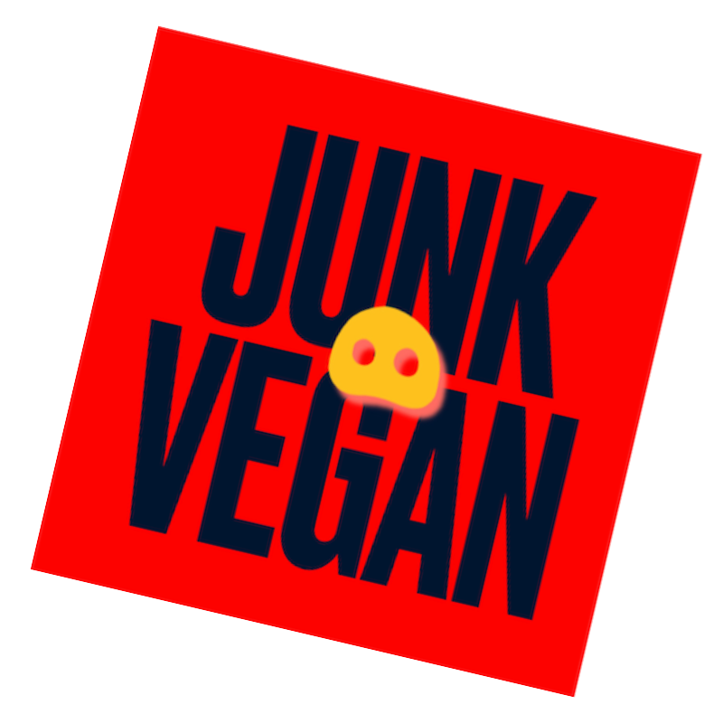 Red ballot or poster with the text 'JUNK VEGAN' and a yellow virus icon in the center.