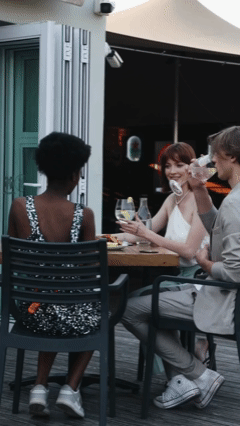 JOSH Gradwell, CAYLEIGH Bancroft and LESEGO NGIDI from AURA Models dining outdoors at a restaurant, enjoying drinks and conversation. Purezza South Africa