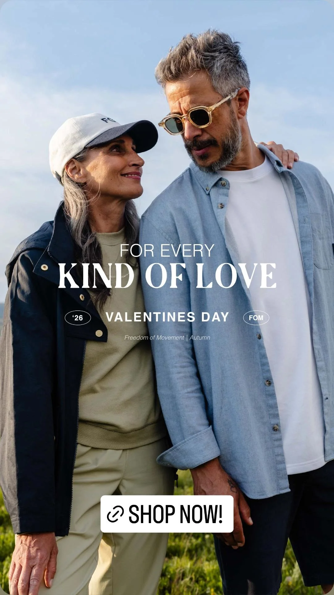 A smiling woman and FEDERICO Fernandez from AURA Models walking outdoors on a cloudy day, holding hands, with the woman looking at the man. The image has text overlay promoting Valentine's Day sales.