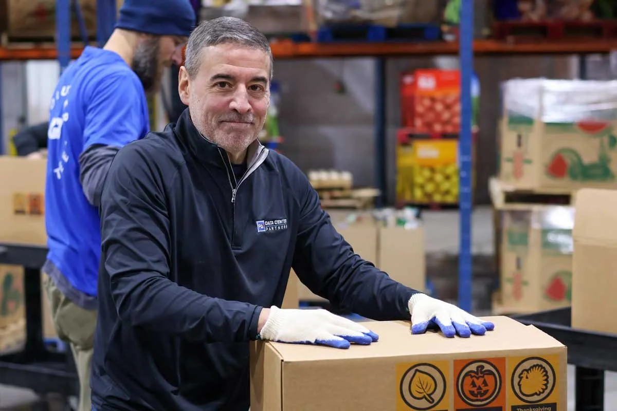 Pennsylvania Data Center Partners General Counsel Andrew Giorgione volunteering at the Central Pennsylvania Food Bank on December 9, 2025, for the Feed a Local Family Initiative.