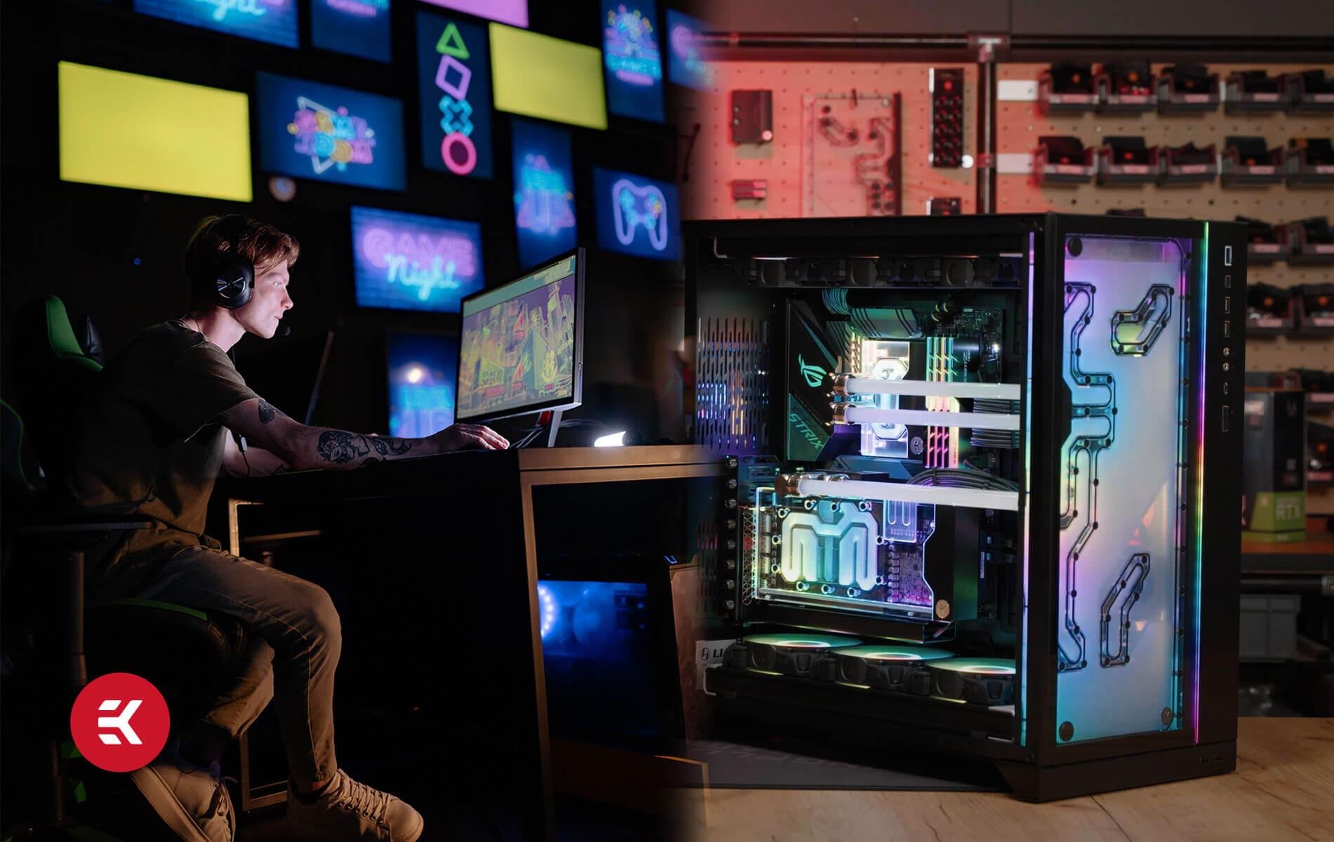 A person sitting at a desk in a gaming or tech store, wearing headphones, working on a computer. Behind them are colorful neon signs and a large computer tower with visible internal components and LED lighting.