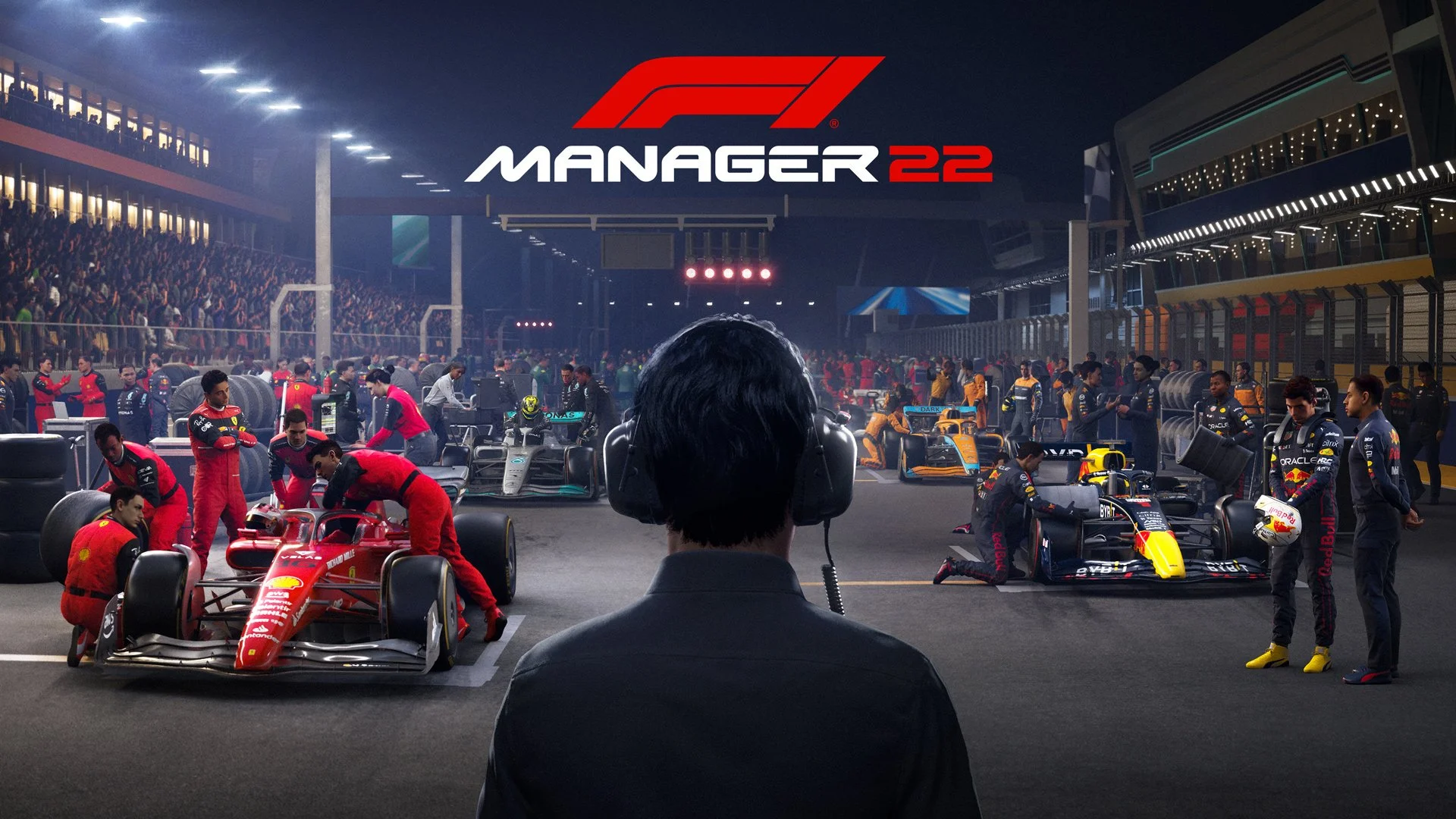 Formula 1 race car garage scene at night with teams preparing cars, a person with headphones observing, and the F1 Manager 22 logo in the sky.