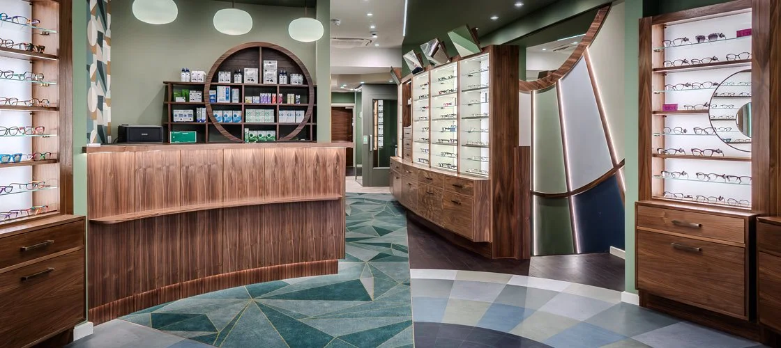 Reception showing view of desk, spectacle frames and client lift
