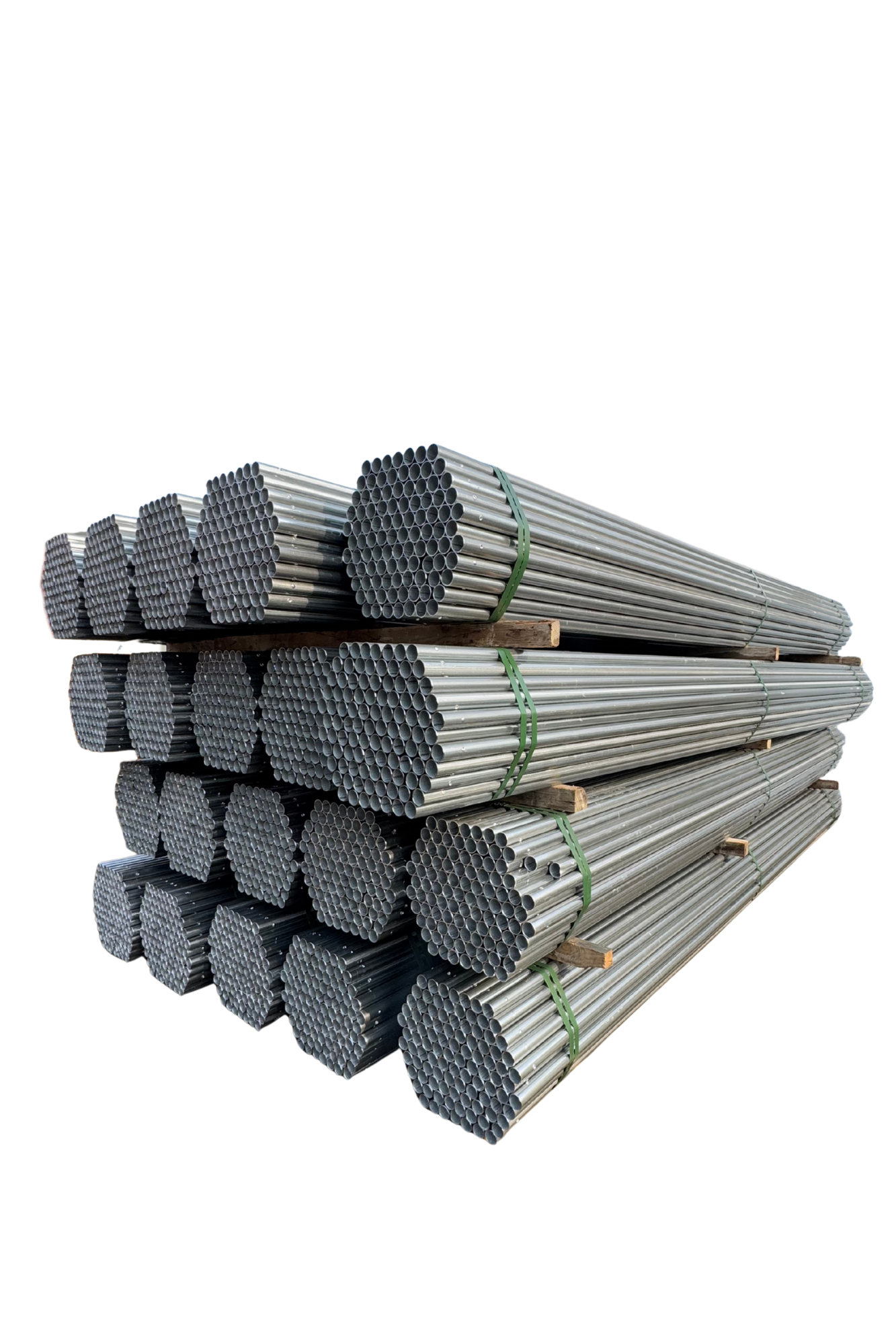 Stacks of metal pipes bundled together on wooden pallets at a construction site.