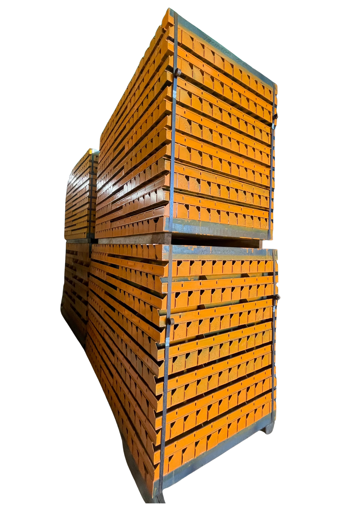 Stacks of orange bricks stored on metal racks against a black background.
