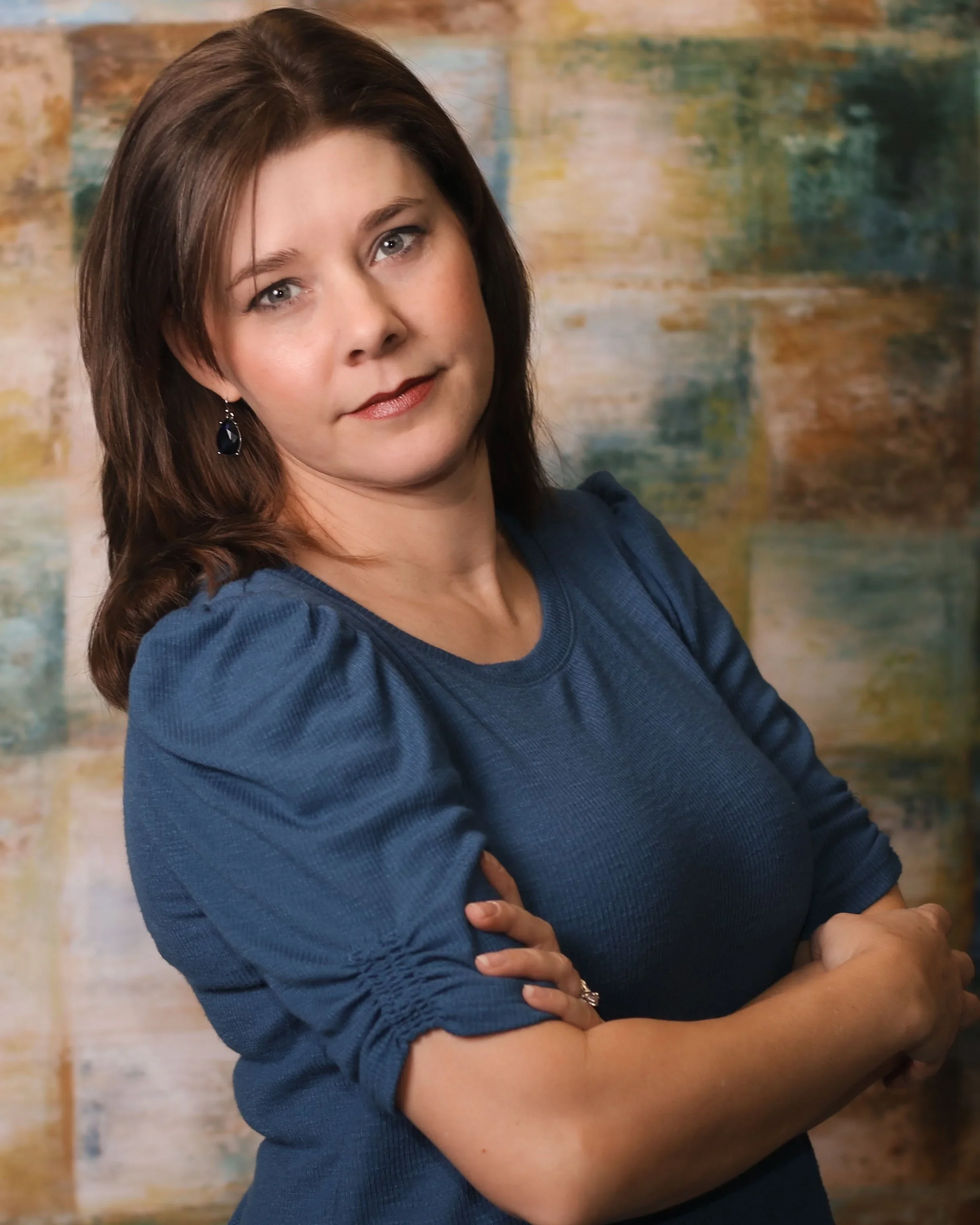 woman with brown hair arms crossed