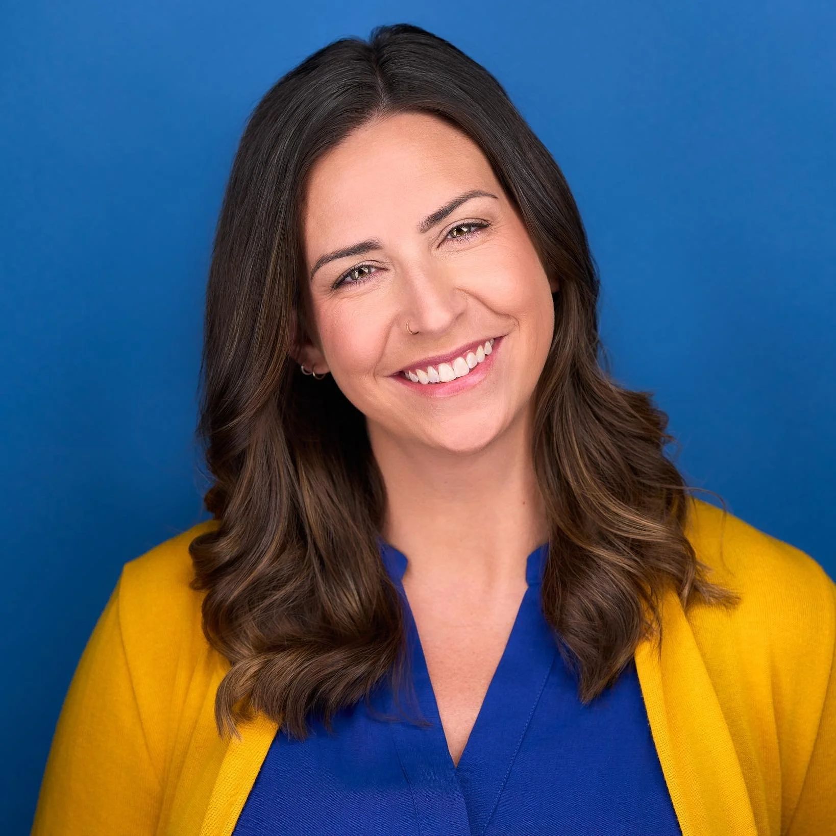picture of a woman with brown hair smiling