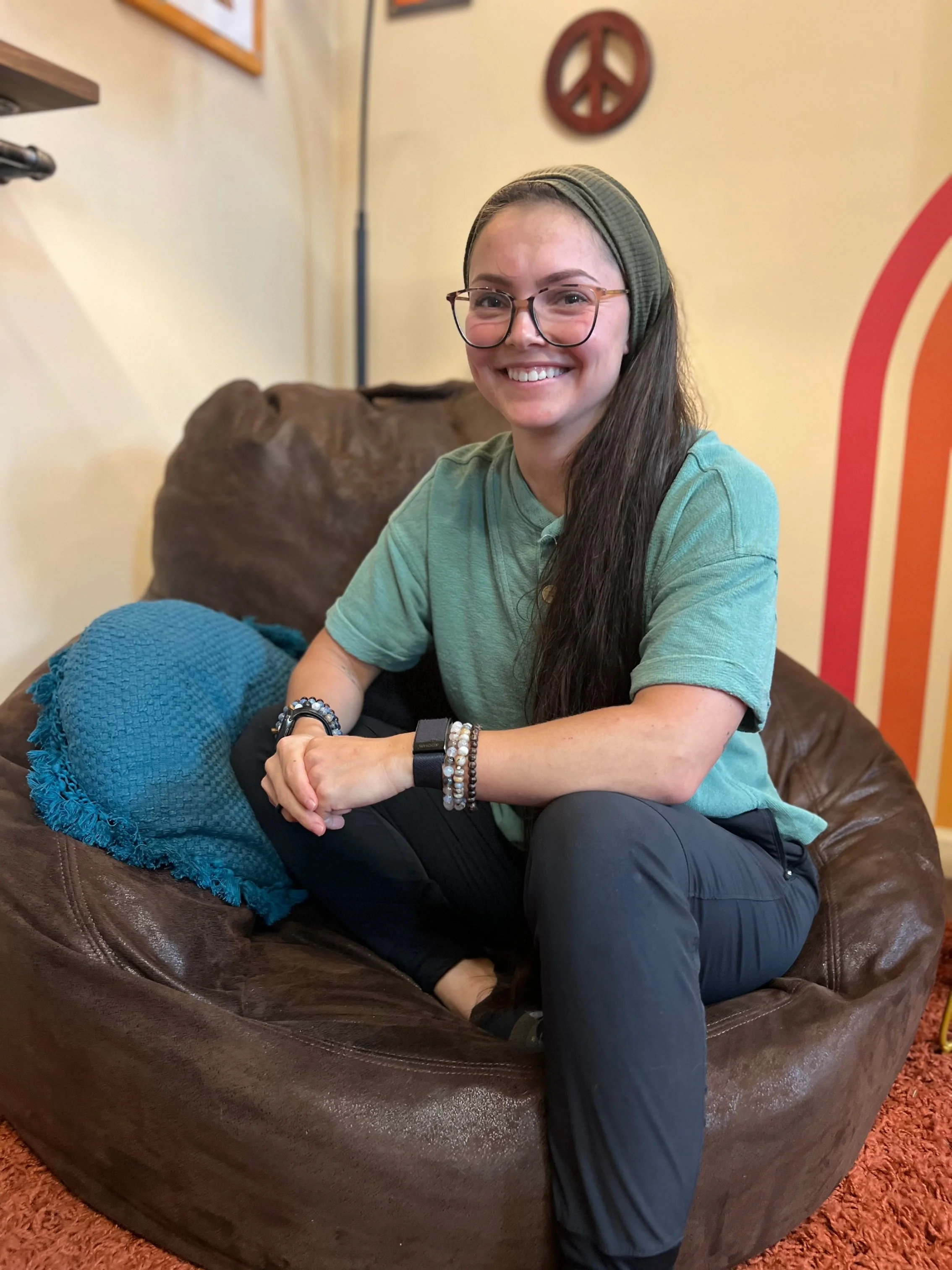 A professional headshot of a dog trainer and behavior consultant