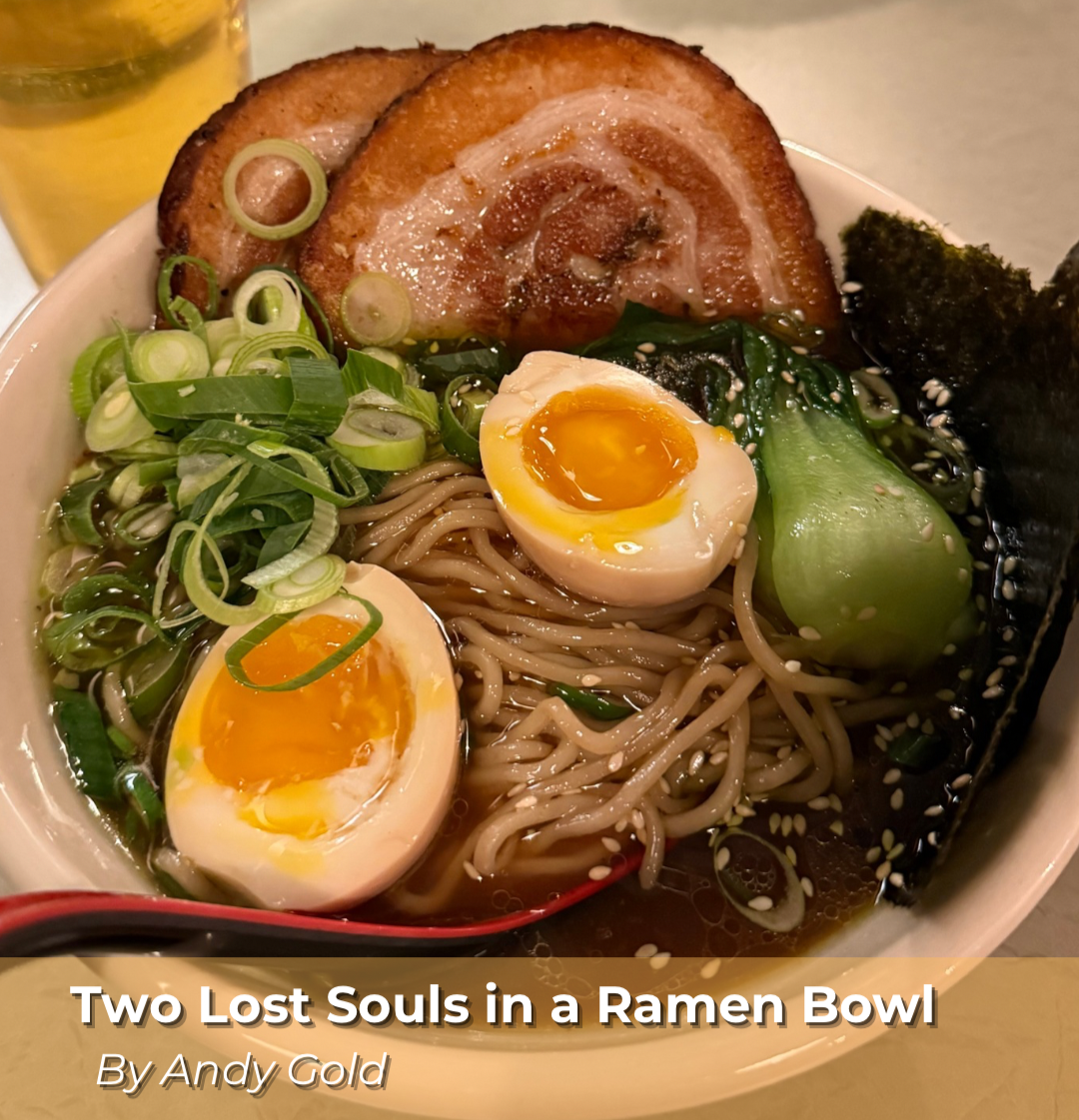 A bowl of ramen with sliced pork, halved soft-boiled eggs, chopped green onions, spinach, seaweed, and noodles in broth from Public Provisions in Rochester. 