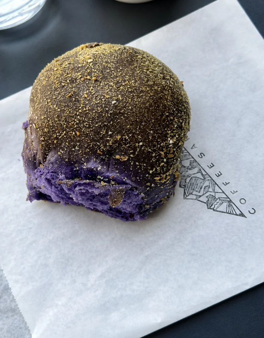 A delicious, subtly sweet Ube pandesal bread roll.