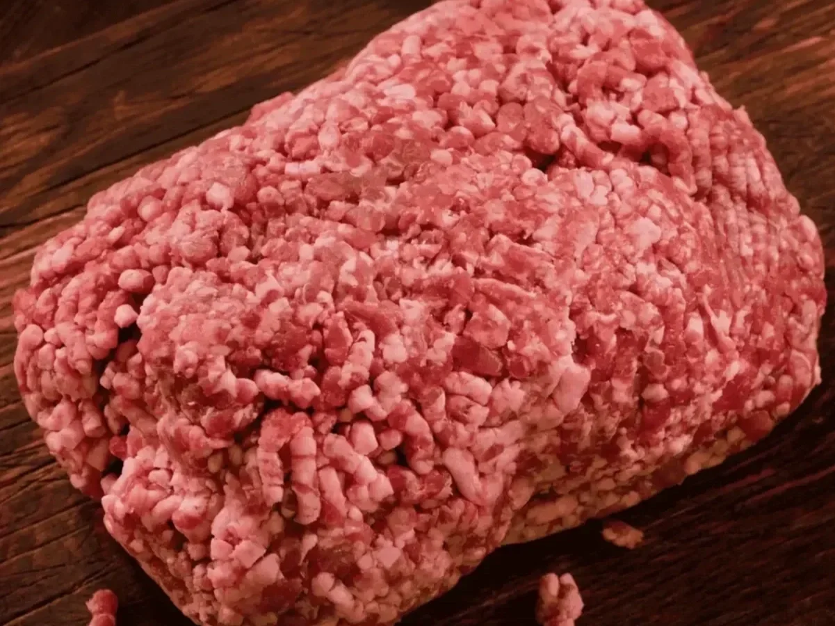 ground-beef-wood-table.webp
