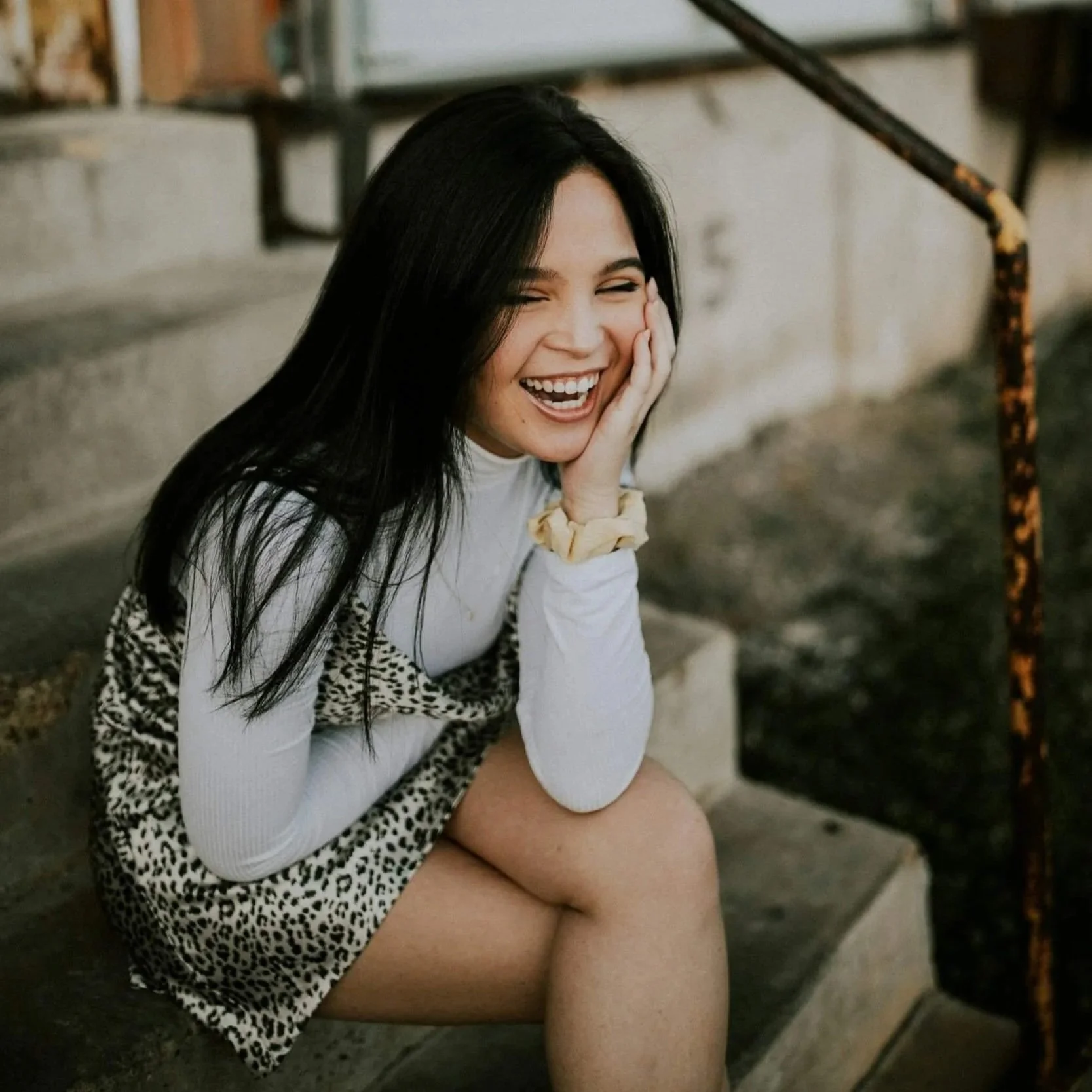 A teen smiling after having therapy for perfectionism.