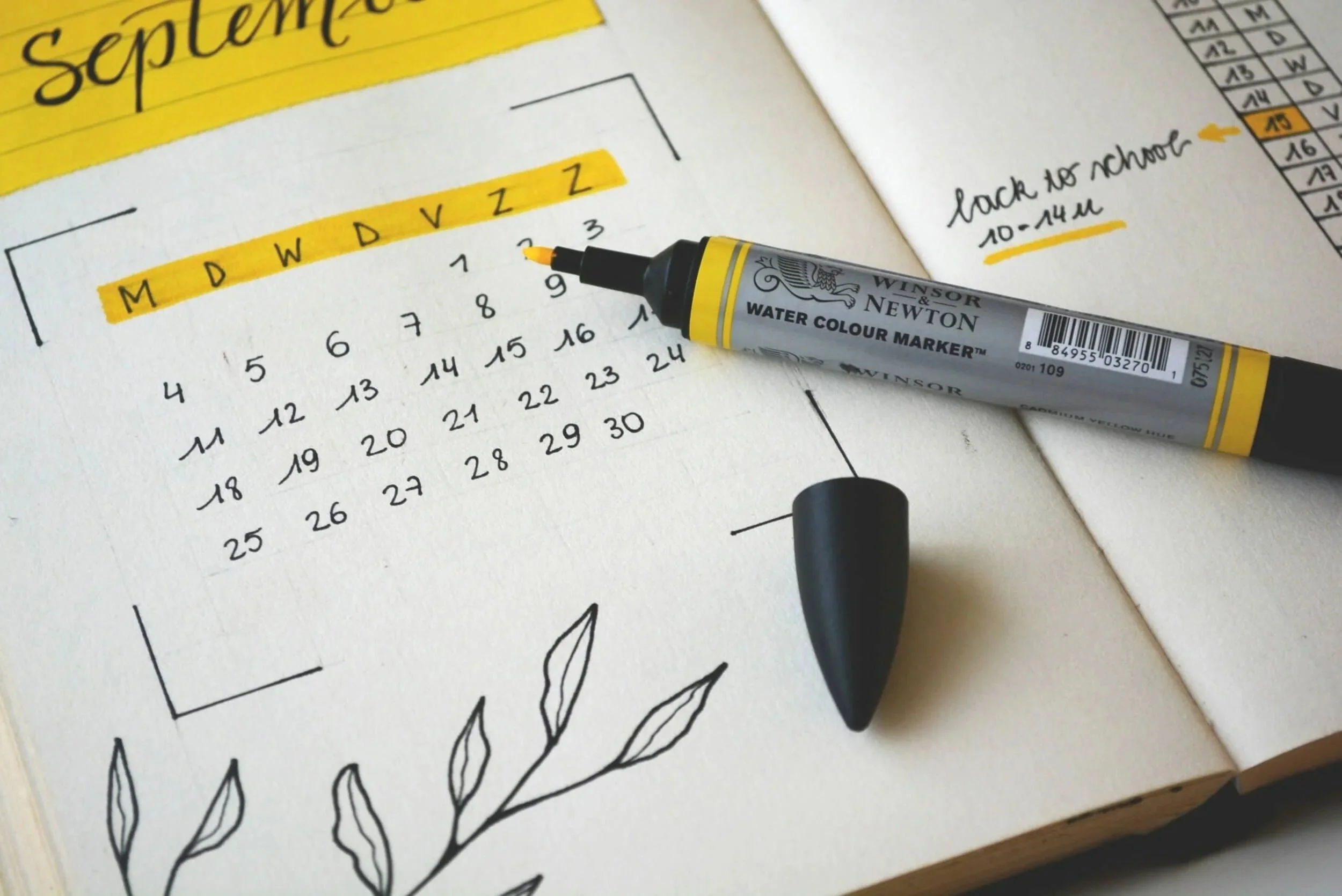 A calendar open to mark a therapist appointment with Angie Yemma