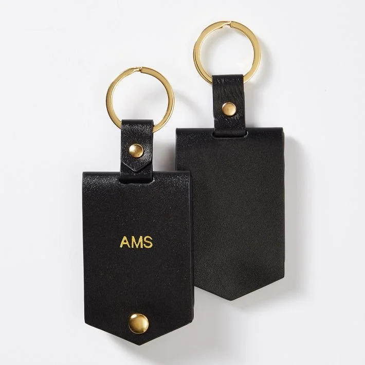 Foil-embossed luggage tags from a private hospitality experience in Amsterdam