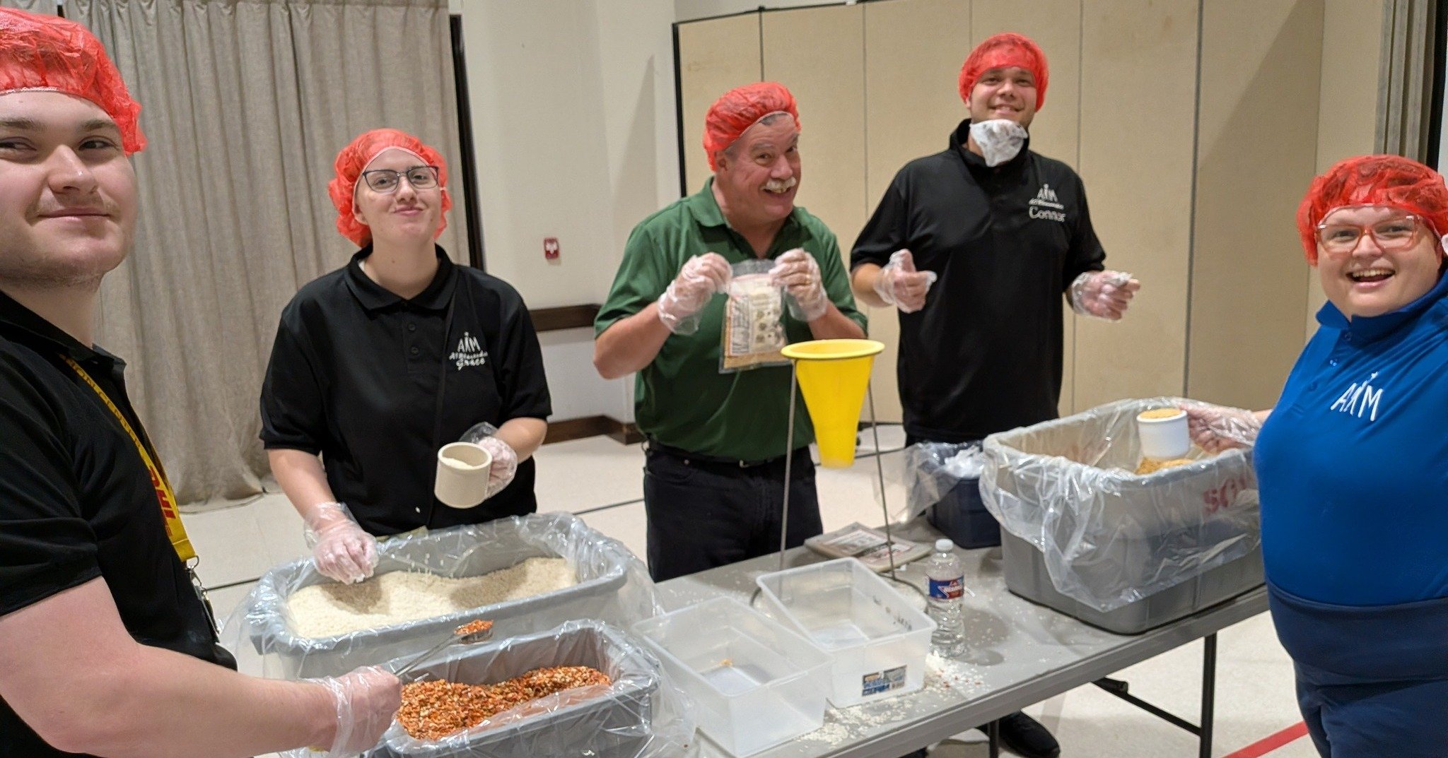Looking back on last month when AIMers joined @lltrotary for the Rise Against Hunger meal packing event. In just one evening, volunteers came together to package more than 10,000 meals for individuals facing food insecurity around the world.

Our AIM