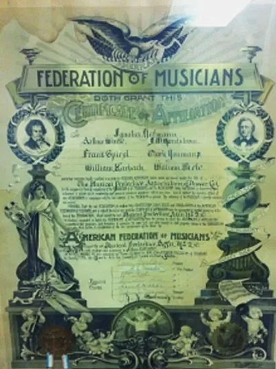 Vintage certificate from the Federation of Musicians featuring ornate design and classical imagery, including columns, statues, and portraits. Text includes names and details related to the American Federation of Musicians.