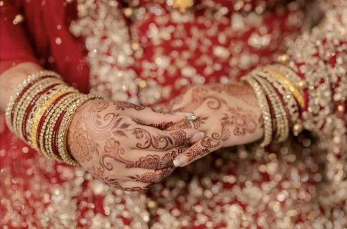 Custom heirloom bridal henna art for modern brides by professional London henna artist. Delicate floral bridal henna hand design on light background by By Karisma. Delicate floral bridal henna hand design on light background by By Karisma.