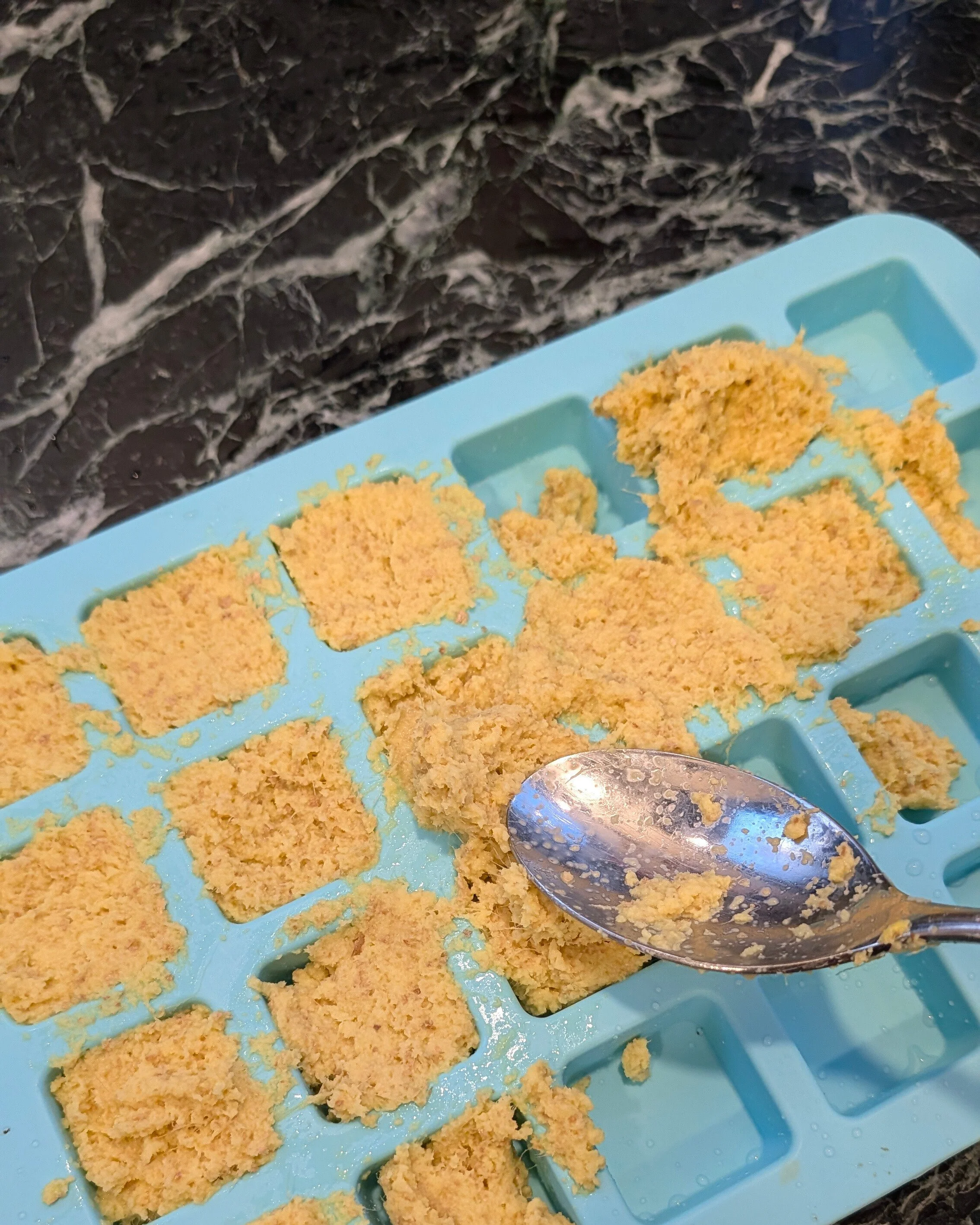 Spread your mix into an ice cube tray, or similar.  This is actually a 'brownie bites' mold.  Each section is 2tbsp which is a useful measure, not to big, not to small!
