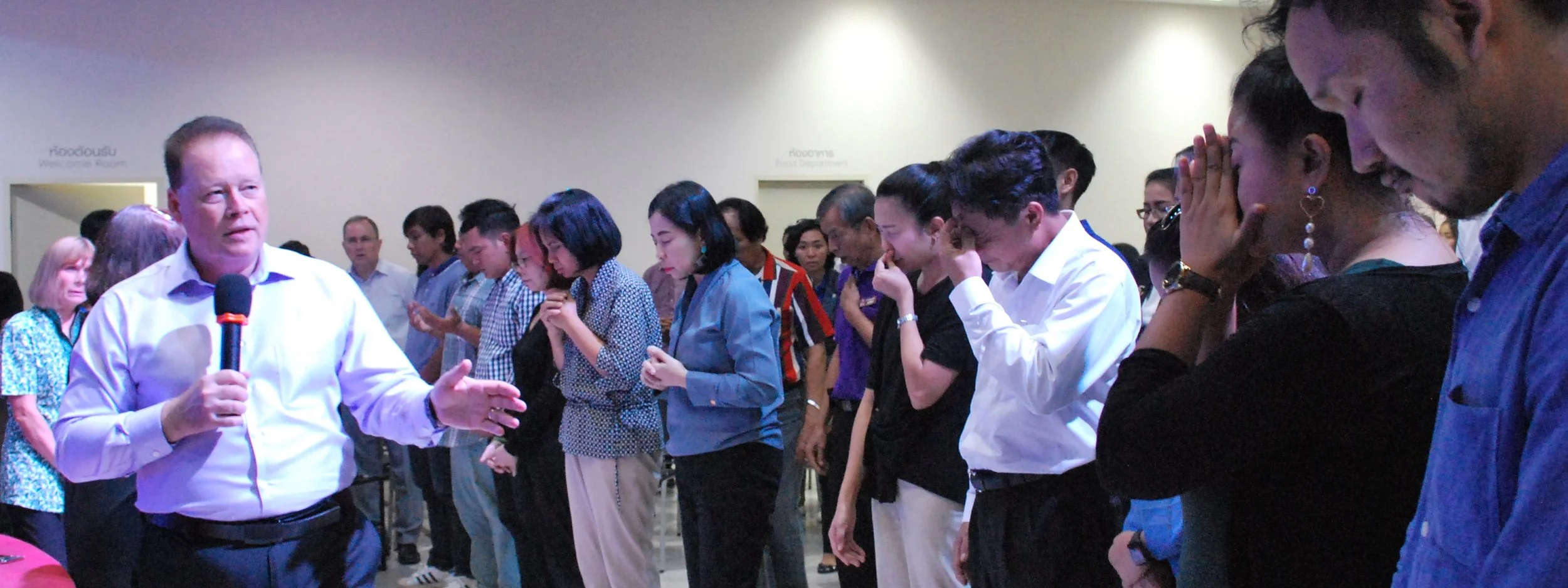 pastor preaching to a group of people