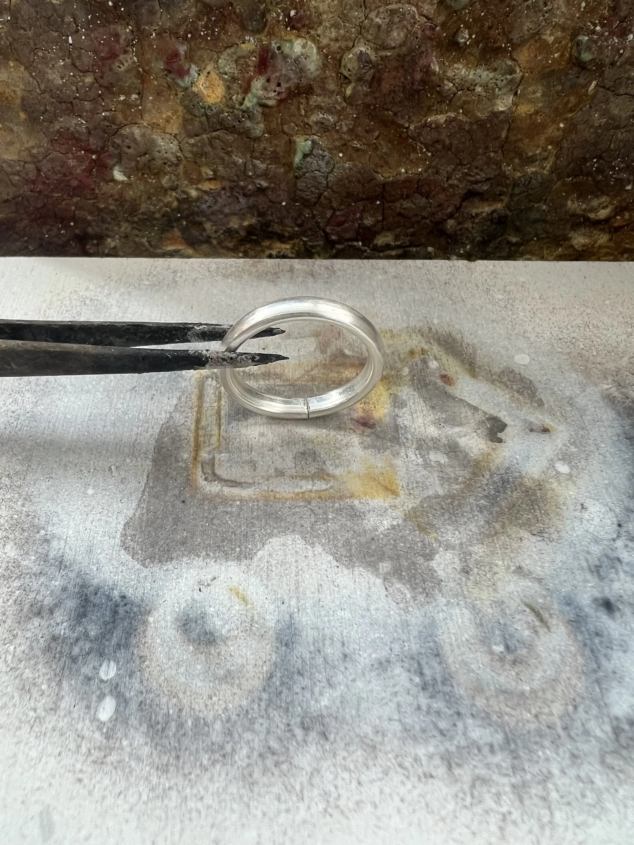 silver ring on soldering block.jpg