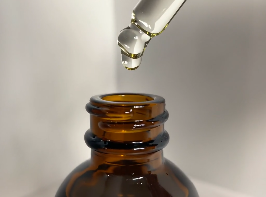 nourishing body oil- oil dropping.png