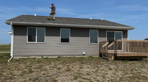 Home inspector performing an 11-month warranty inspection on interior components and systems in a newer construction home in Minnesota
