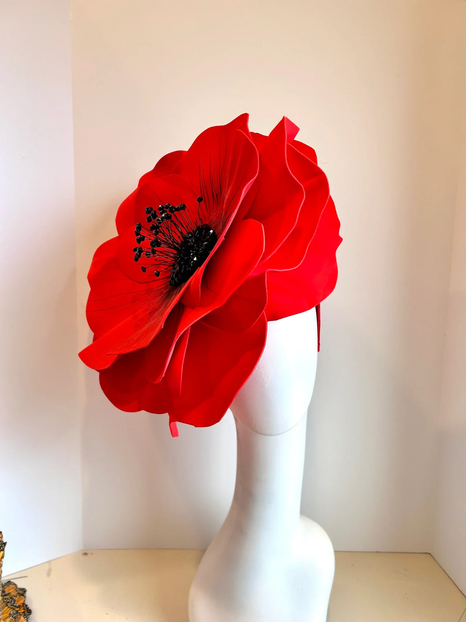 Dora Marra Red flower headpiece on a white mannequin head 1960's style headwear fascinator custom made 