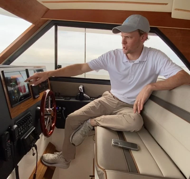 Austin at boat helm.jpeg