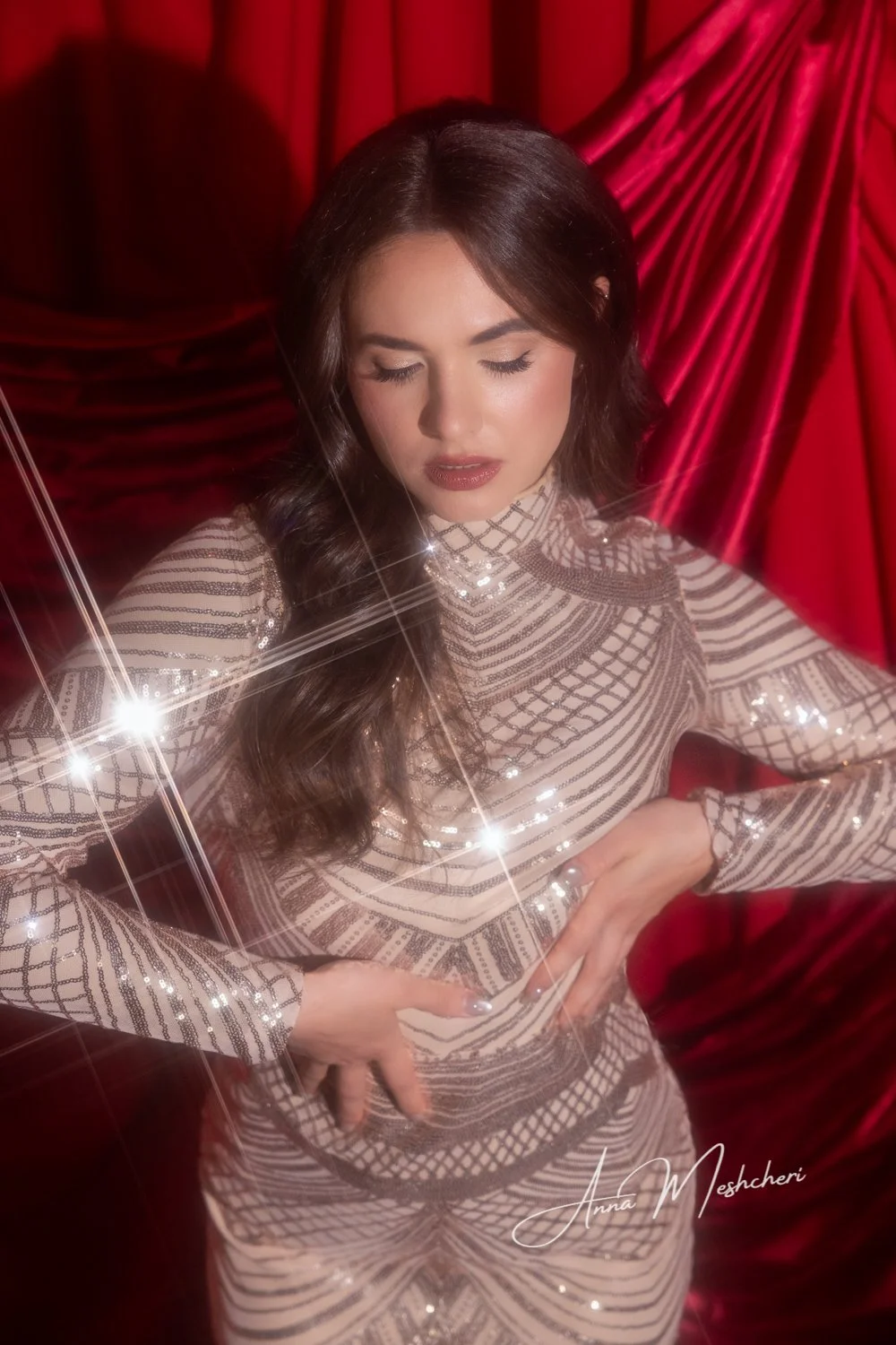 Luxury Hollywood glam studio photography with custom red drapes, editorial lighting, and cinematic in-camera photography effects.