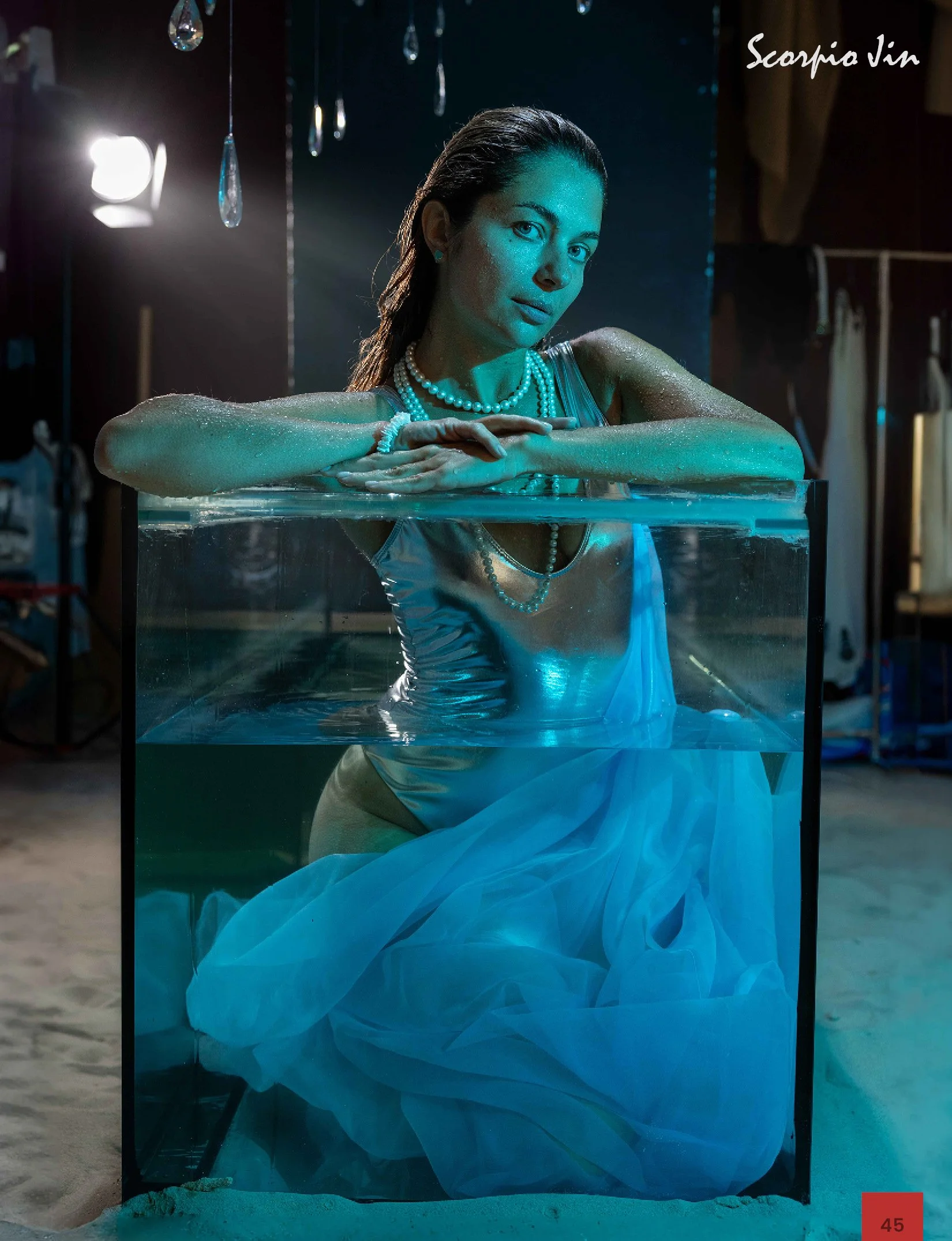 Fashion editorial with aquarium elements, photographed by Anna Meshcheri for a published magazine feature