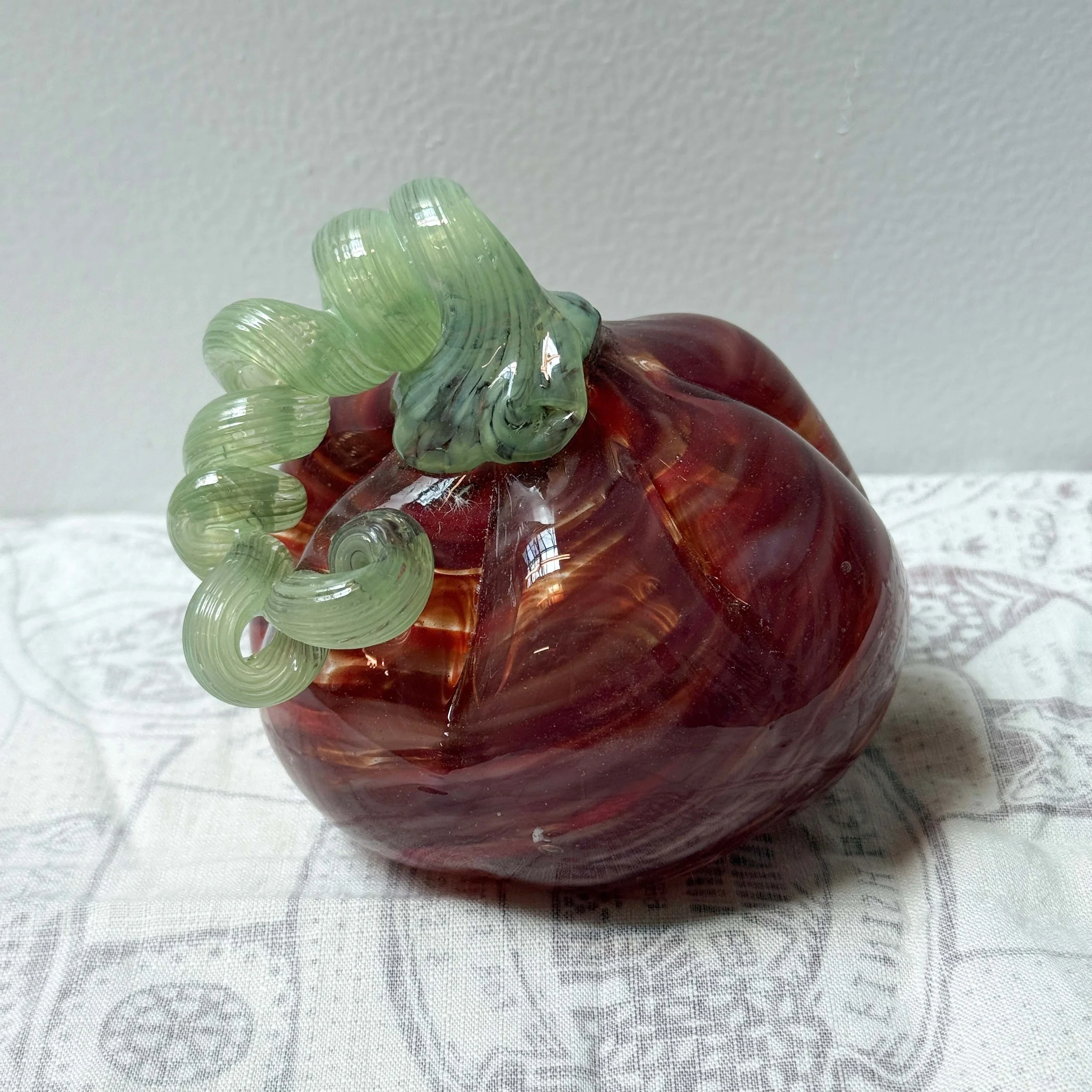 red pumpkin with light green stem