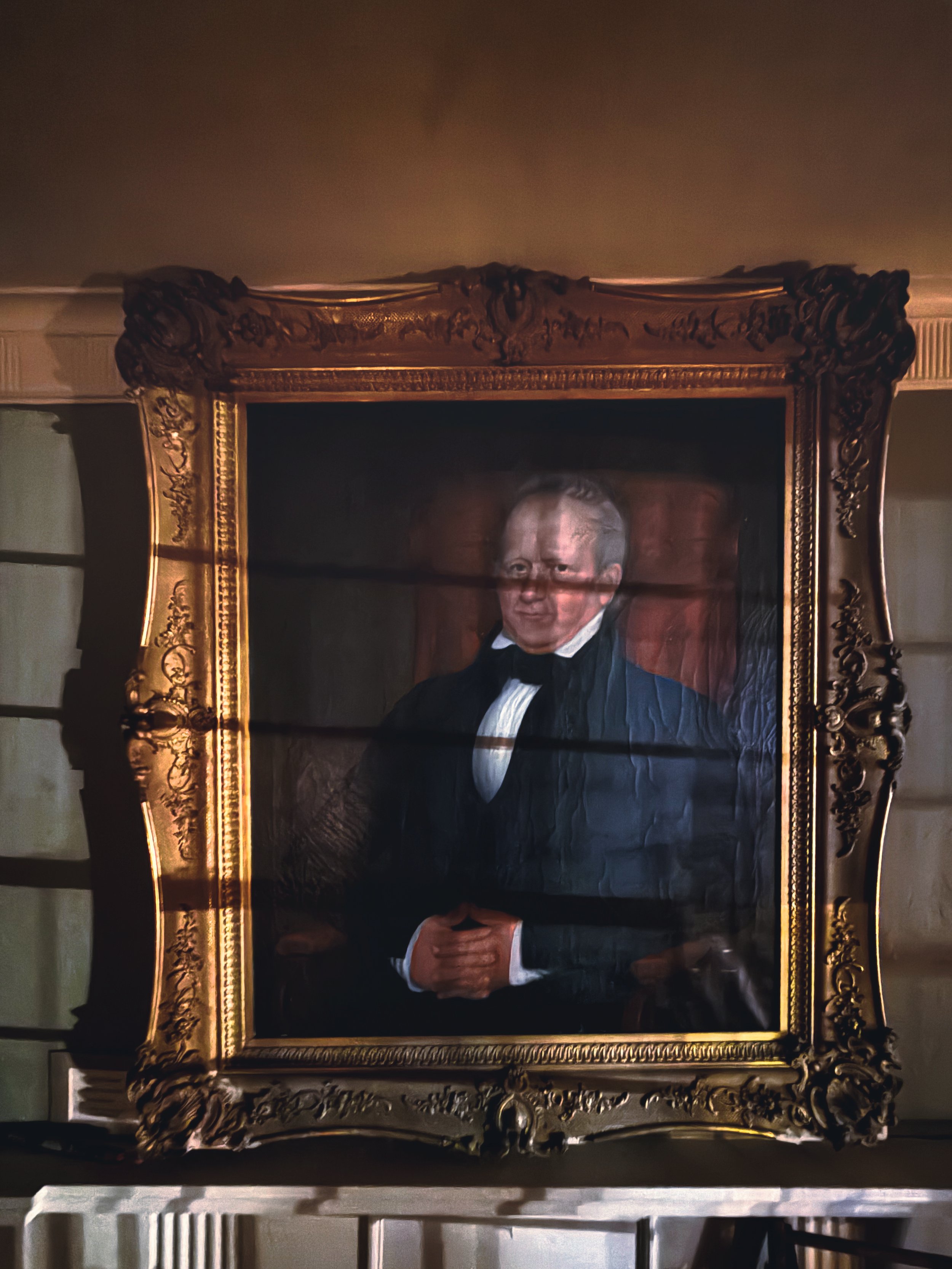 Stern antique portrait watching over haunted historic house.jpg