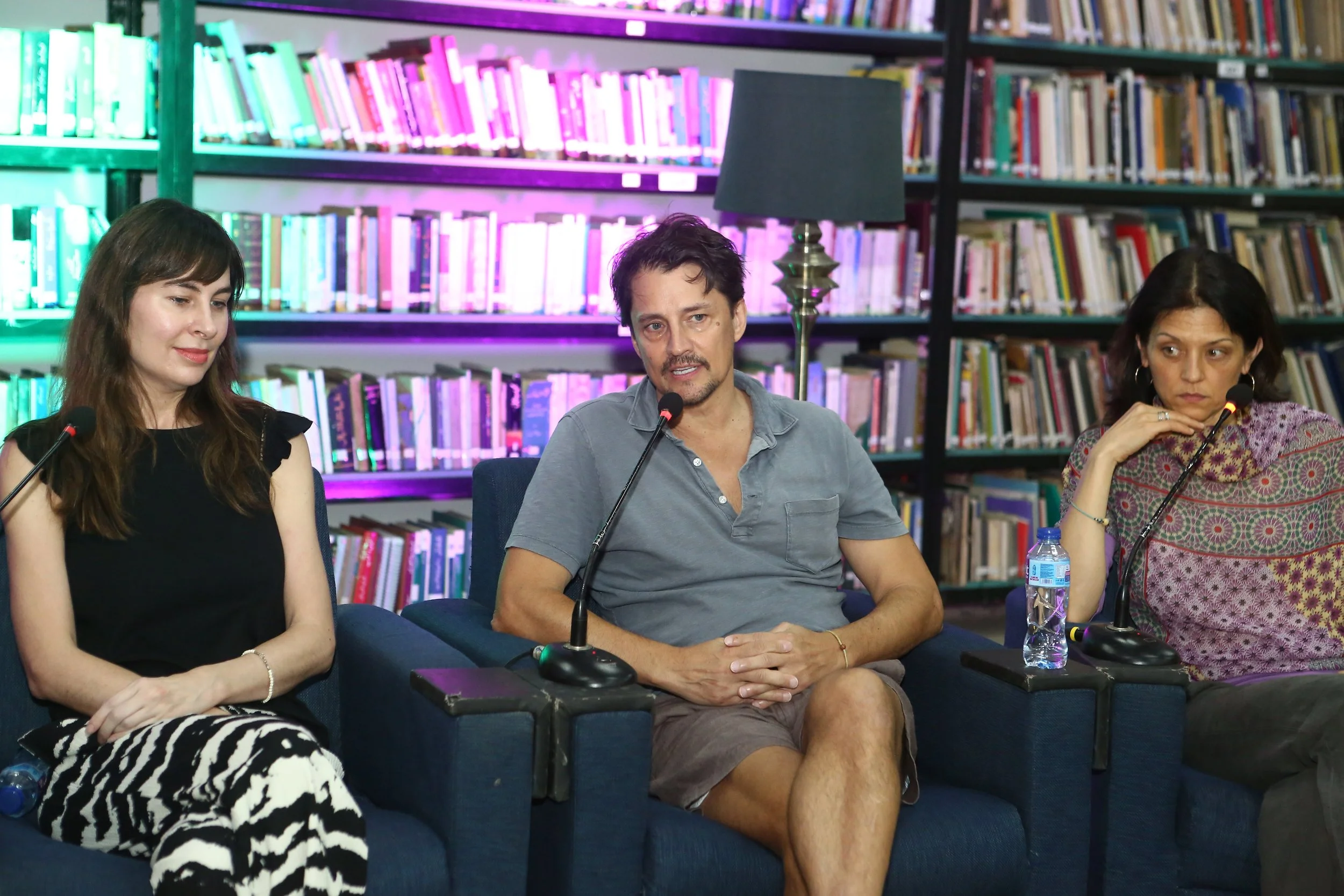 Bonnie J. Evans, Alex Liu, and Erica Lauren Wise sit on a panel in Karachi, Pakistan, October 2024